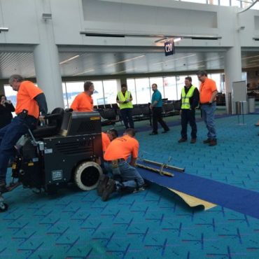Dual-lift scraper easily removes commercial carpeting