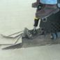 Ride-on scraper removing ceramic tile